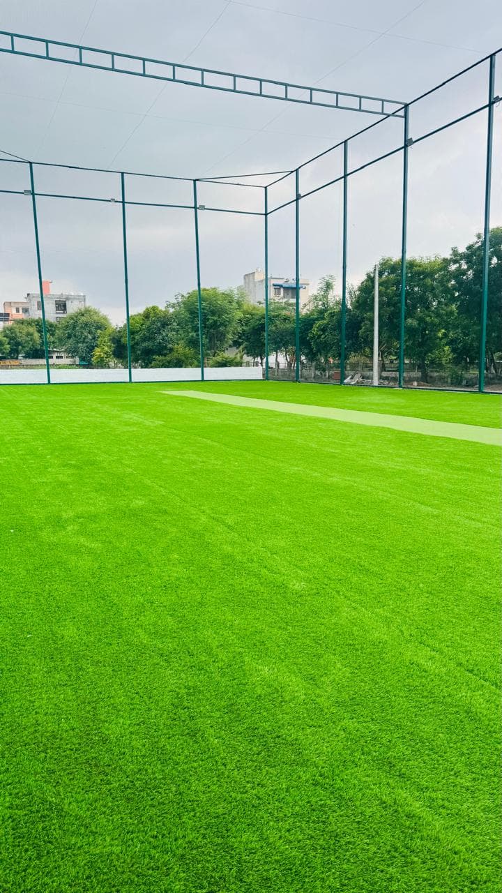 Daytime corner view of the fully enclosed cricket turf